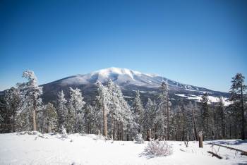 A mountain in Flagstaff, AZ covered in fresh snow during winter